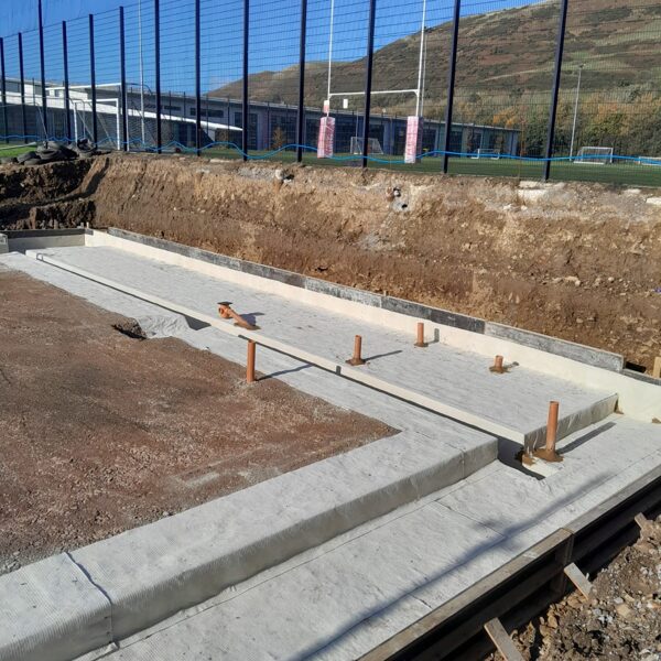 Atal Bentofix 5000 to a slab, sealing pipe penetrations with a fillet of Atal Bentonite Fi
