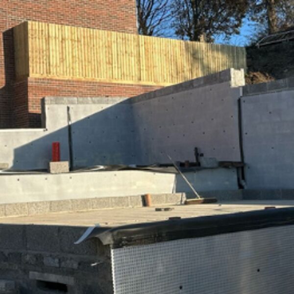 Atal CM8 to a step in level and retaining blockwork walls on a site in Ilfracombe. 