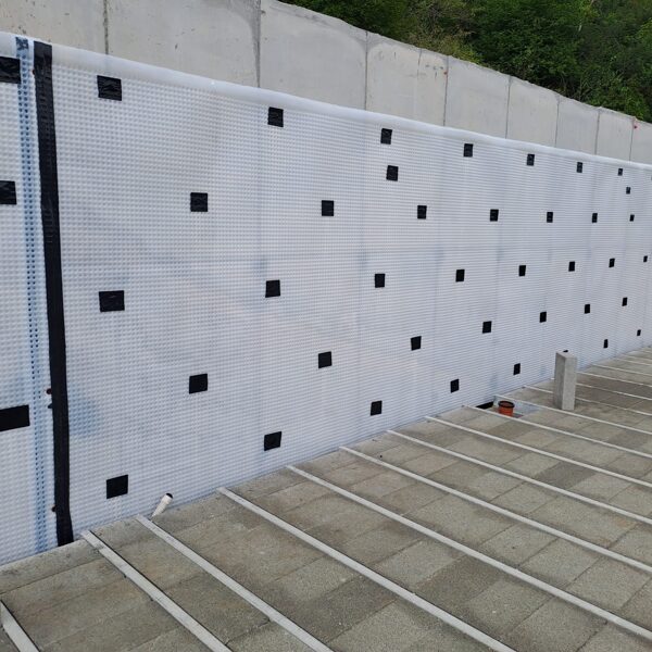 Atal CM8 to internal face of a retaining wall to a site in Glamorgan.