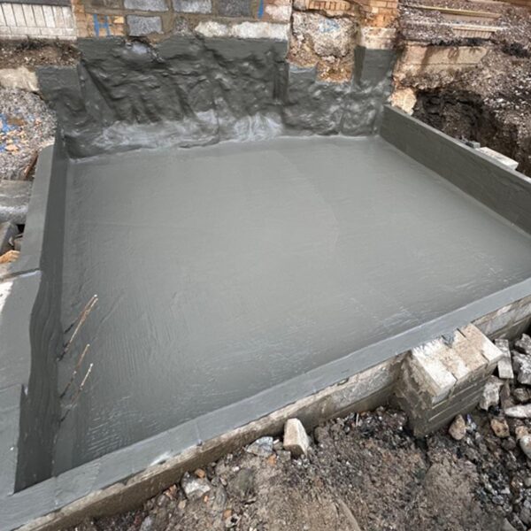 Type A. Hydra dry to a pre-cast lift shaft base. Cementitious coating.