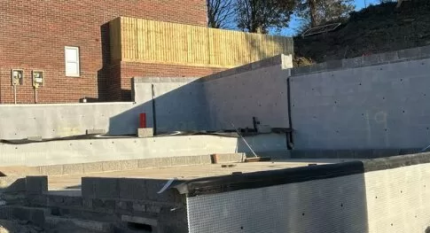 Atal CM8 to a step in level and retaining blockwork walls on a site in Ilfracombe.