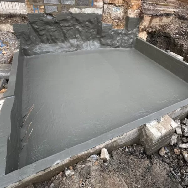 Type A. Hydra dry to a pre-cast lift shaft base. Cementitious coating.